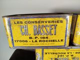 three tins that are stacked on top of each other