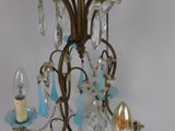 a small chandelier with three lights hanging from it