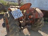 an old tractor that is sitting in the dirt