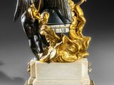 an image of a statue of an angel with a scythe on a marble base