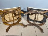two chairs that are sitting on a tile floor