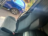 a seat in the back of a car with a seat belt