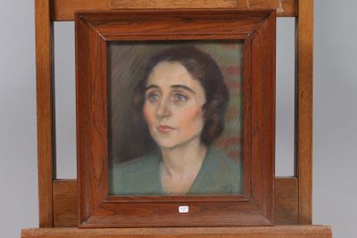 painting of a woman in a green dress in a wooden frame