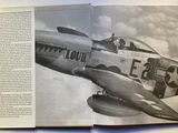 an open book with a picture of a fighter plane in it