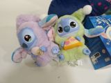 two stuffed animals sitting next to each other on a table
