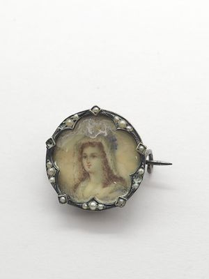 a close up of a picture of a woman on a broocher