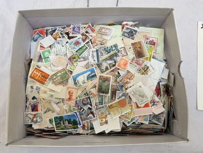 a box full of postage stamps sitting on a table