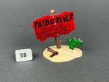 a small sign that says patto ' s diner next to a toy cactus