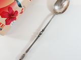 a spoon and a book sitting on a table