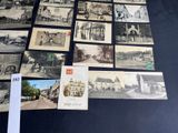 a lot of old black and white photos on the table