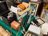 a pile of assorted items sitting on a green table