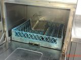 a dirty dishwasher in the middle of an open oven
