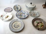 a lot of plates and bowls on the table