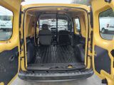 a yellow van that is parked in the parking lot