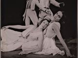 black and white photograph of a group of dancers posing for a picture