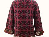 an image of a woman ' s jacket on a mannequin base