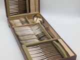 a wooden box with a set of silverware in it