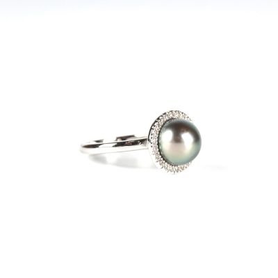 an image of a black pearl and diamond ring on a white background