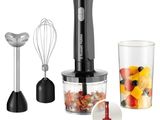 an image of a blender with a blender and a cup of fruit