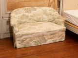a chair and a bed in a small room