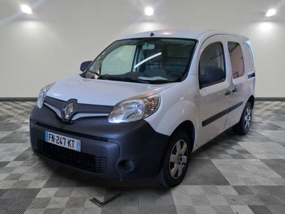 a picture of a small white van parked in a garage