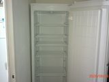 an image of a refrigerator in a kitchen with the door open