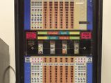a vending machine that has a lot of chips on it