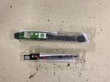 two pens that are sitting on top of a table