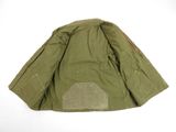 the jacket is green and has a brown patch on the back