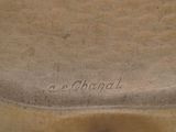 a close up of a brown vase with writing on it