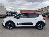 a white and red citrole parked in a parking lot