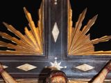 a statue of jesus on a cross with a star above it