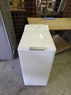 an image of a white dishwasher sitting in a room