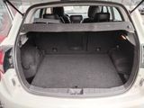 the back of a car with its trunk open in a parking lot