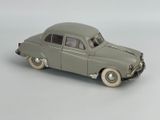 a toy car that is sitting on a white surface