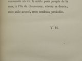 an old book with a black and white picture on it