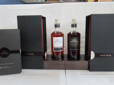 several bottles of liquor are sitting on a table with boxes