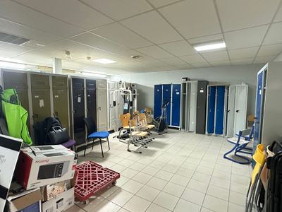 a photo of a room with a lot of lockers