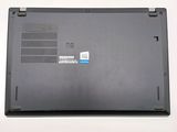 a black laptop with a blue sticker on the back of it