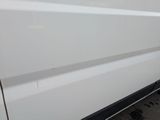 a white van that has been painted white with a black stripe