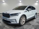 a white car parked in a room with a checkered floor
