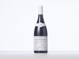 a bottle of wine that is sitting on a table