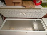 a white chest that is open on the floor