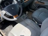 a car that is sitting in a parking lot with the door open