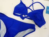 a close up of a blue bikinisuit on a white table