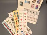 a lot of stamps on a table with a keyboard