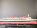 a model of a cruise ship on display on a table