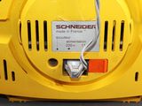a close up of a yellow machine with wires attached to it