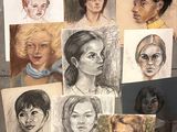 many different colored drawings of people on the wall