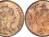 a close up of two pennys on a white background